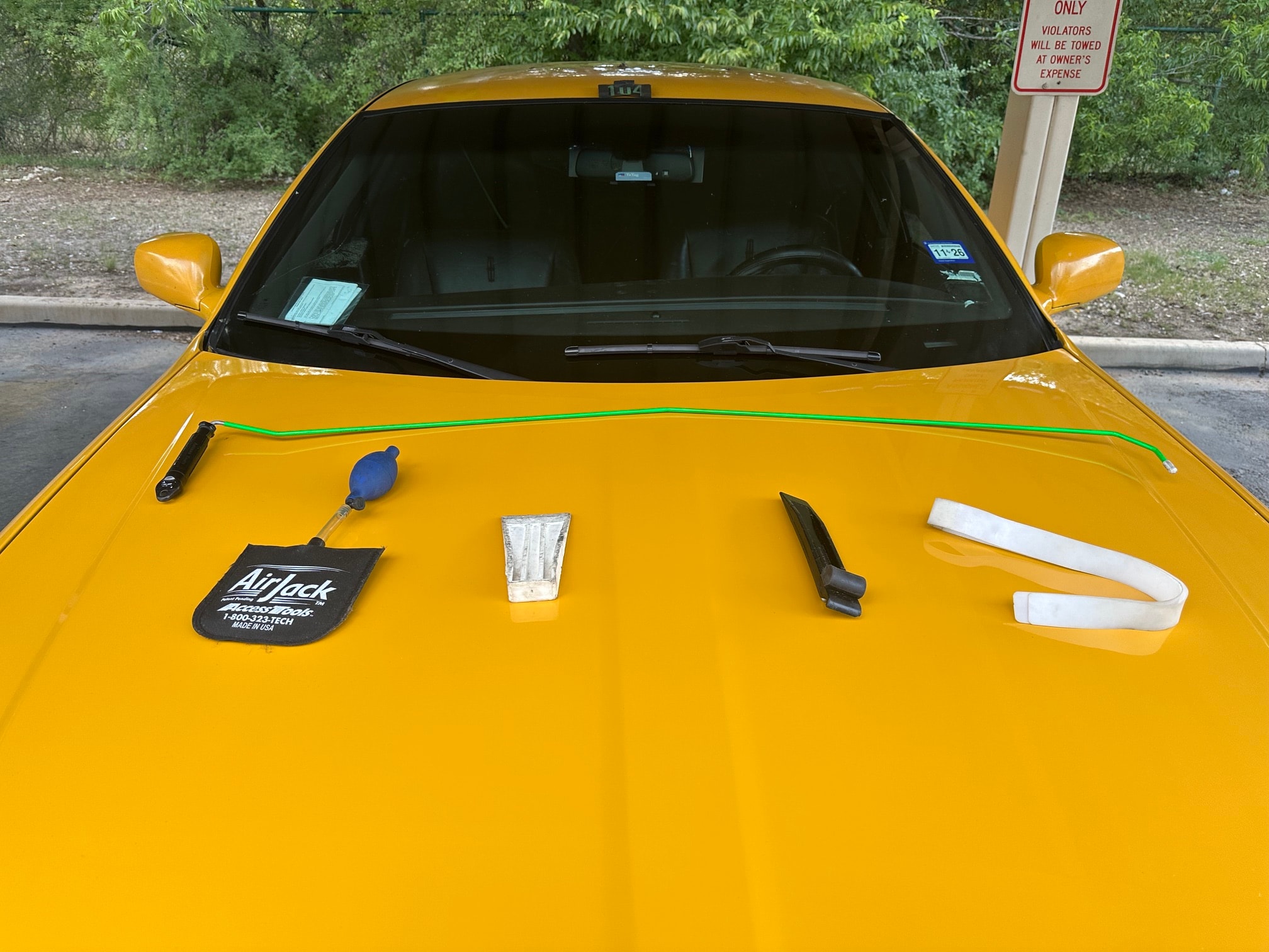 Professional lockout tools displayed on the SAETAXI hood